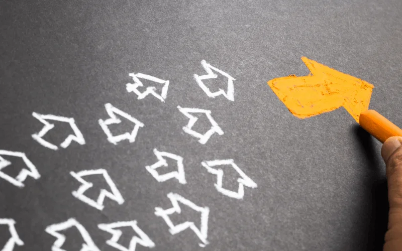 white chalk arrow outlines on ground
